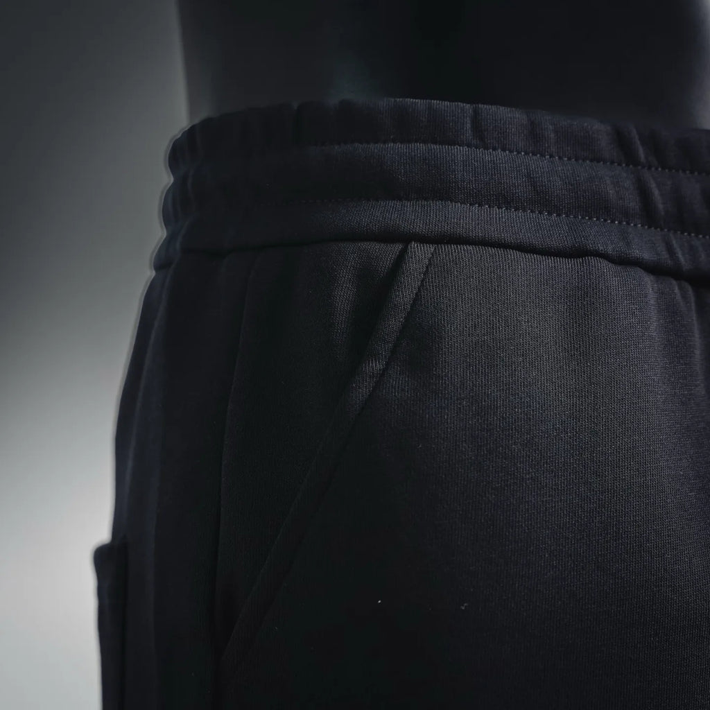 Black shorts waistband with drawstring channel and seam detail