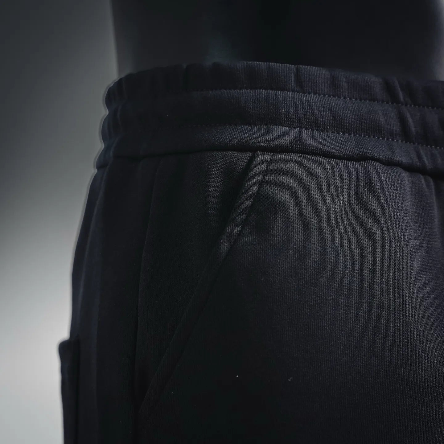 Black shorts waistband with drawstring channel and seam detail