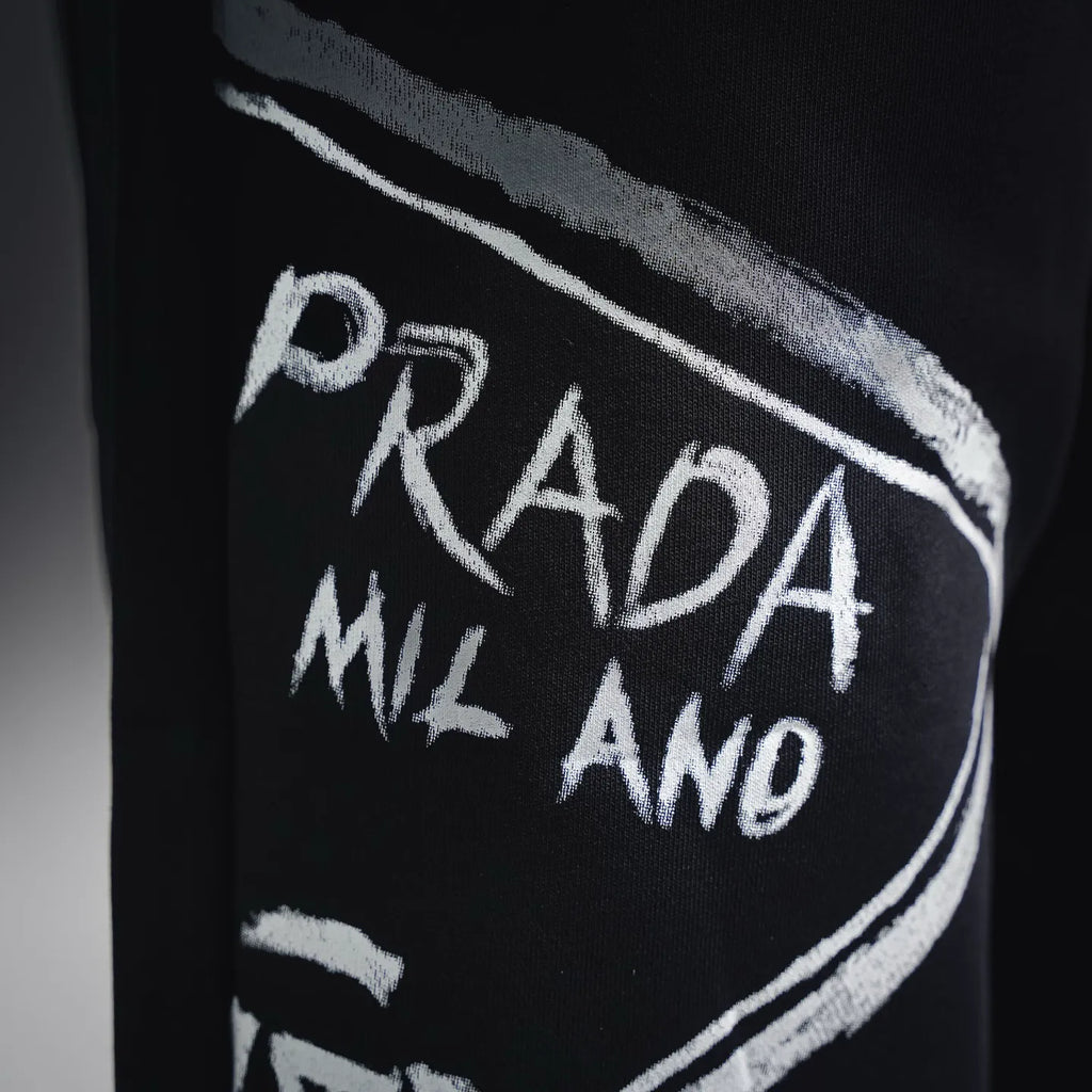 Black shorts with white PRADA Milano graphic on side panel