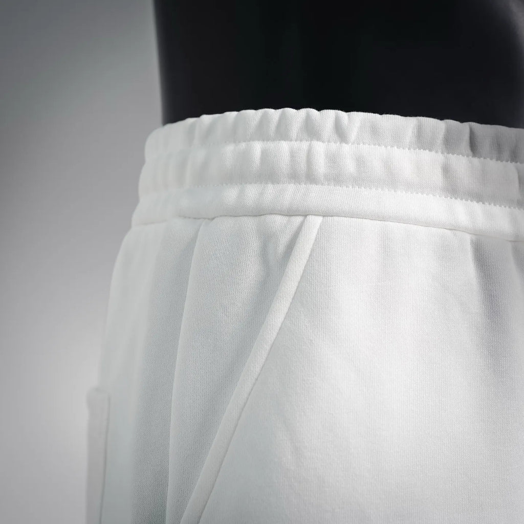 White shorts with pleated front and relaxed straight leg