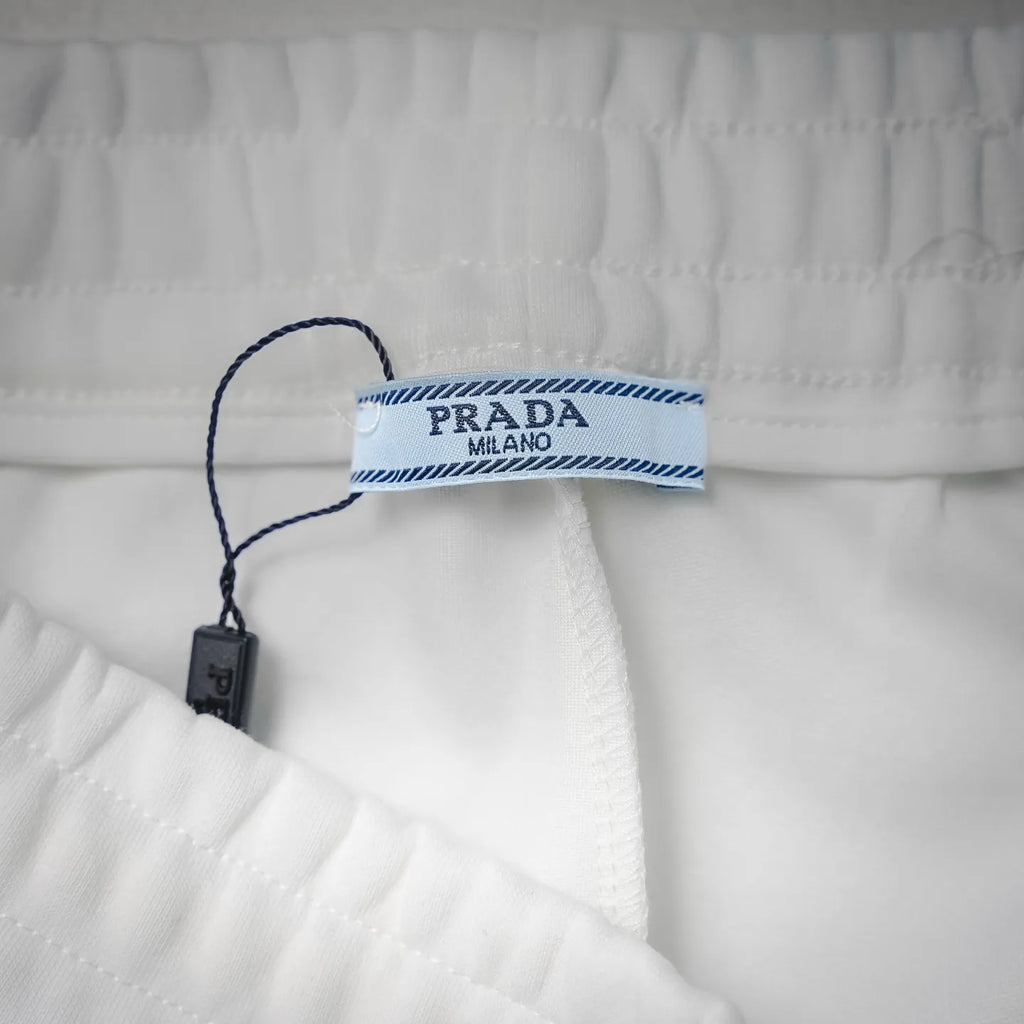 White shorts care tag on inner waistband with Prada Milano label