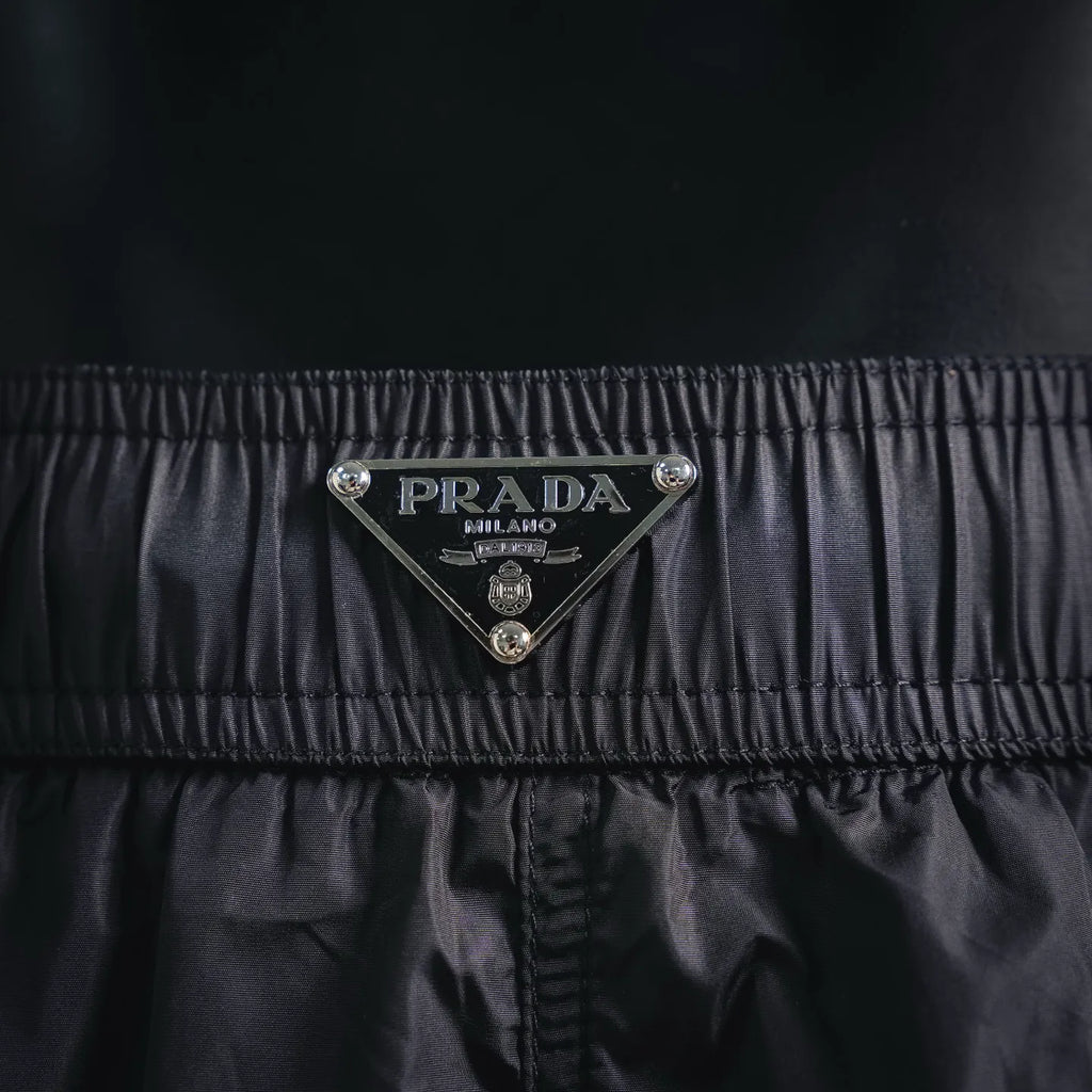 Prada black shorts with triangular Prada Milano logo patch