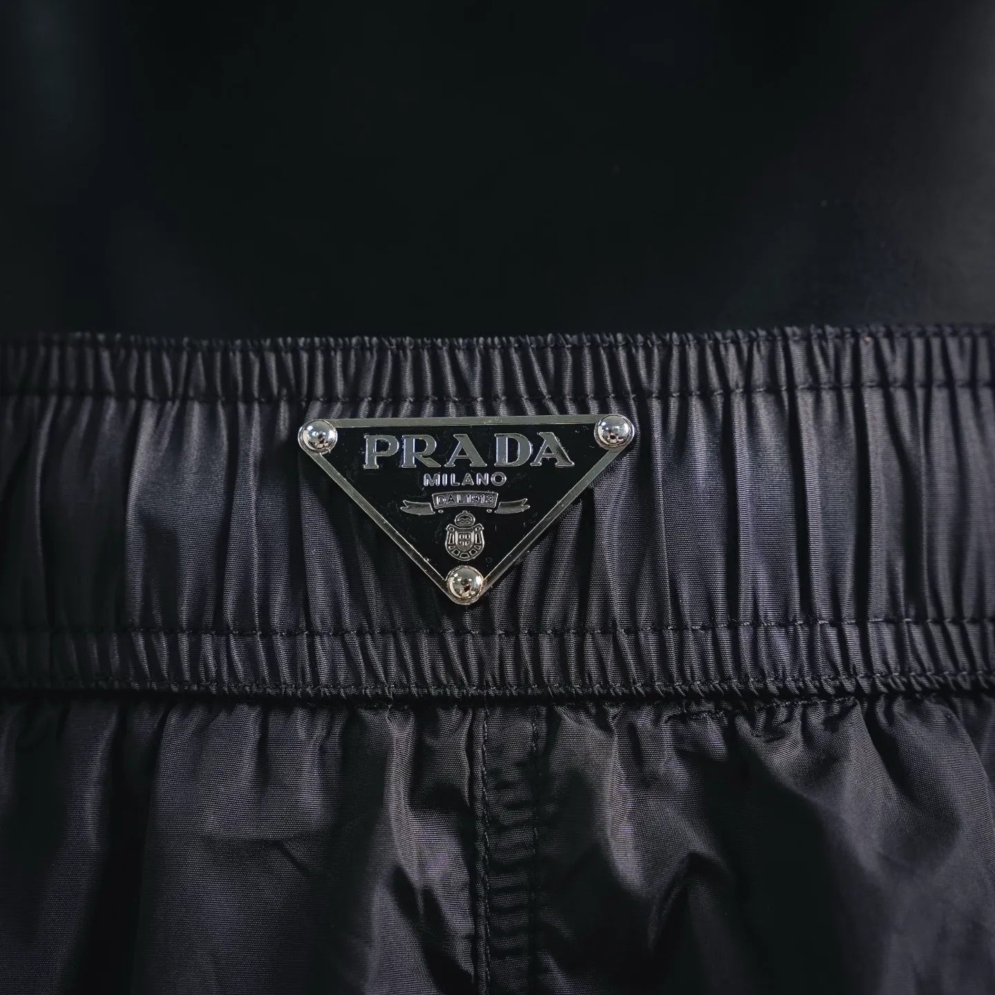 Prada black shorts with triangular Prada Milano logo patch