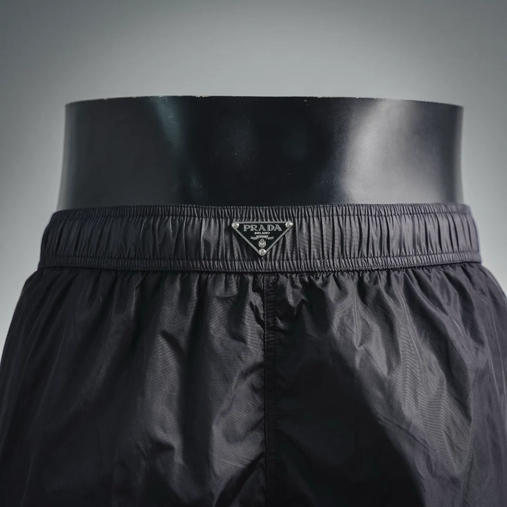 Prada black shorts front waistband with Prada logo plaque