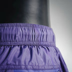 Prada purple shorts waistband close-up with elastic ruching and stitching
