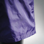 Prada purple nylon shorts hem close-up with gathered seam detail