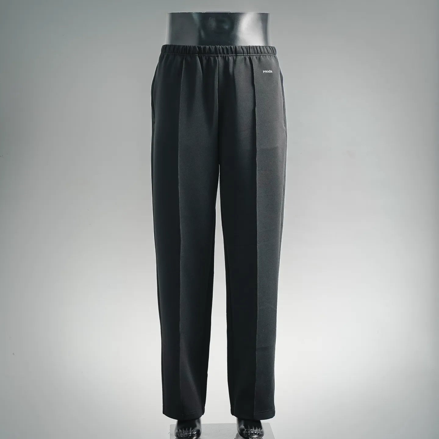 Prada dark trousers with elastic waistband and straight legs