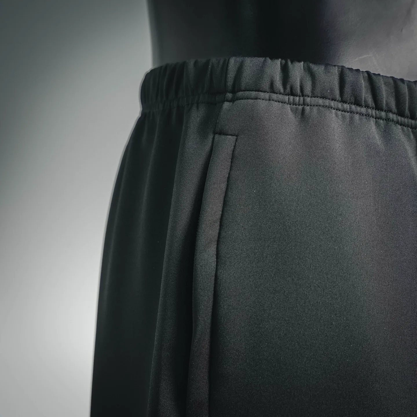 Prada dark pants waistband with elastic and stitched front panel