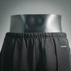 Prada dark pants with elastic waistband and small 'PRADA' side logo