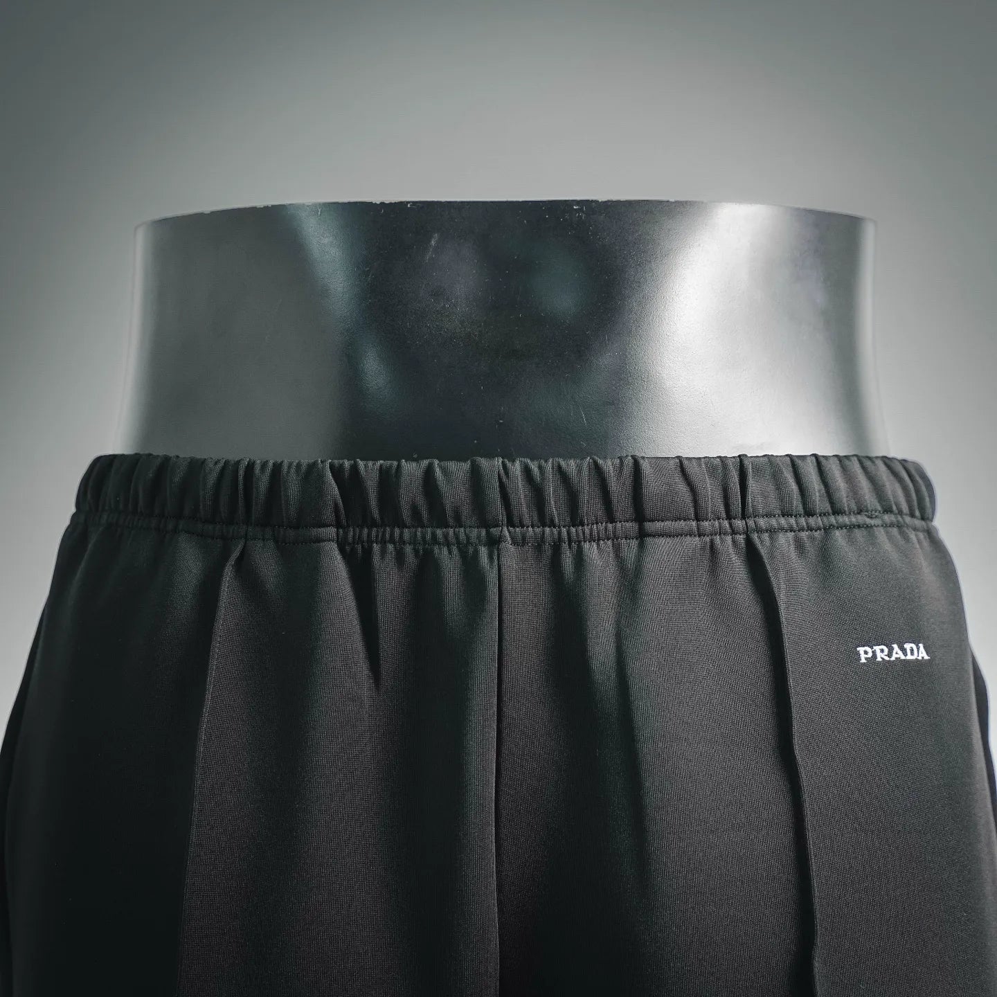 Prada dark pants with elastic waistband and small 'PRADA' side logo