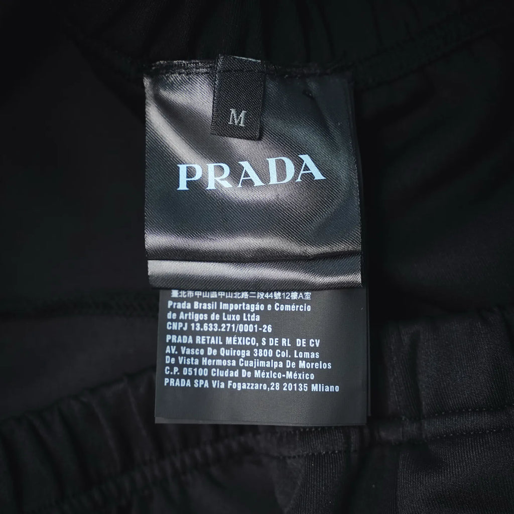 Prada dark pants interior label with size M and branding