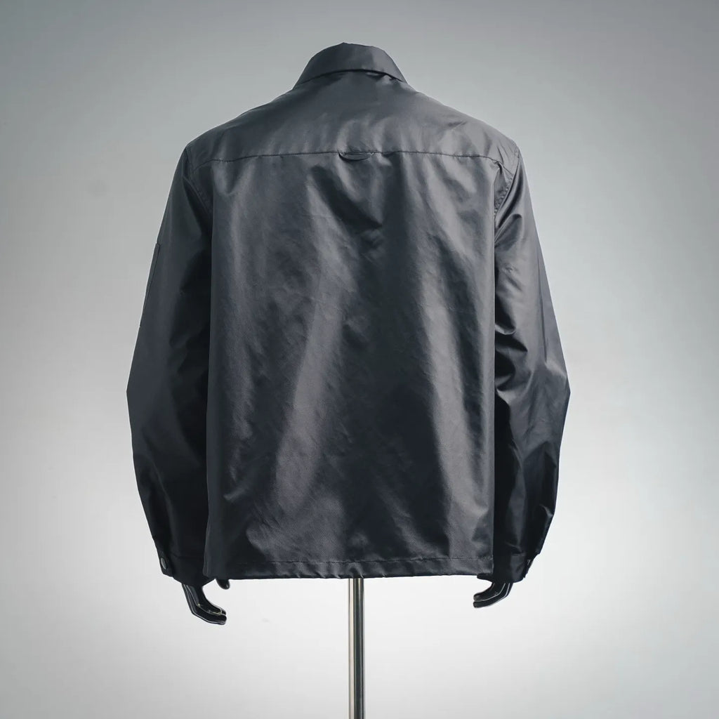 Prada dark gray zip-up jacket, back view with stand collar and stitched seams