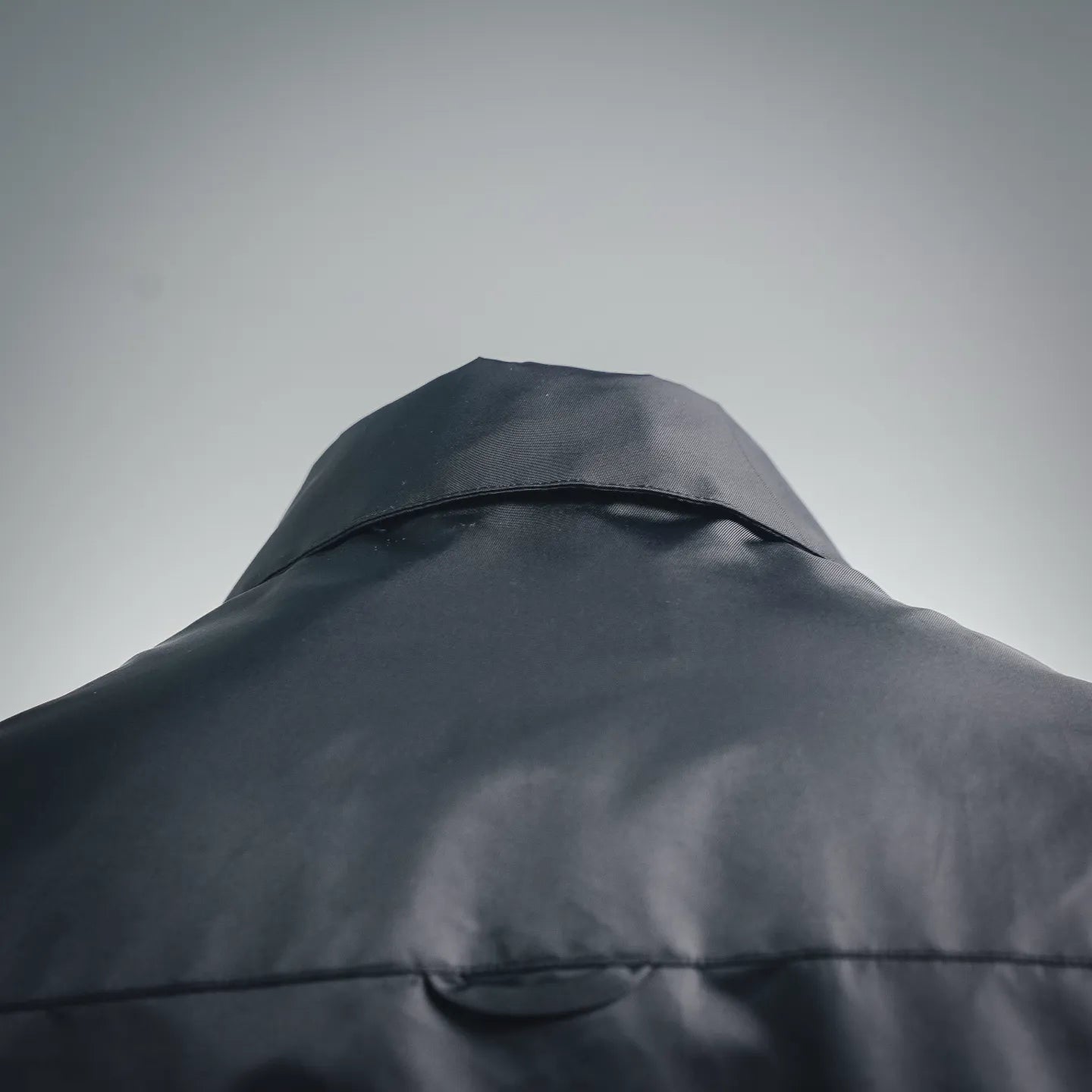 Prada dark gray jacket hood with curved seam and structured top panel