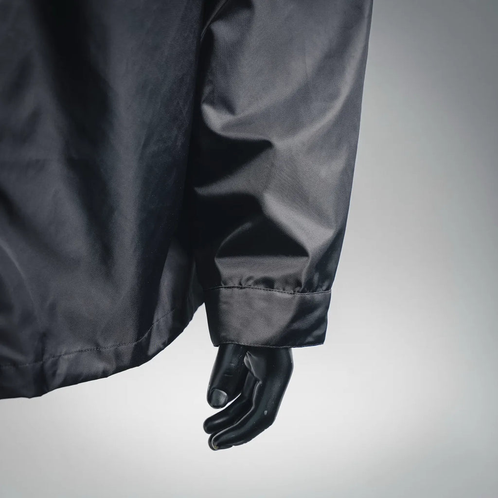 Dark gray jacket sleeve with elastic cuff and side seam detail