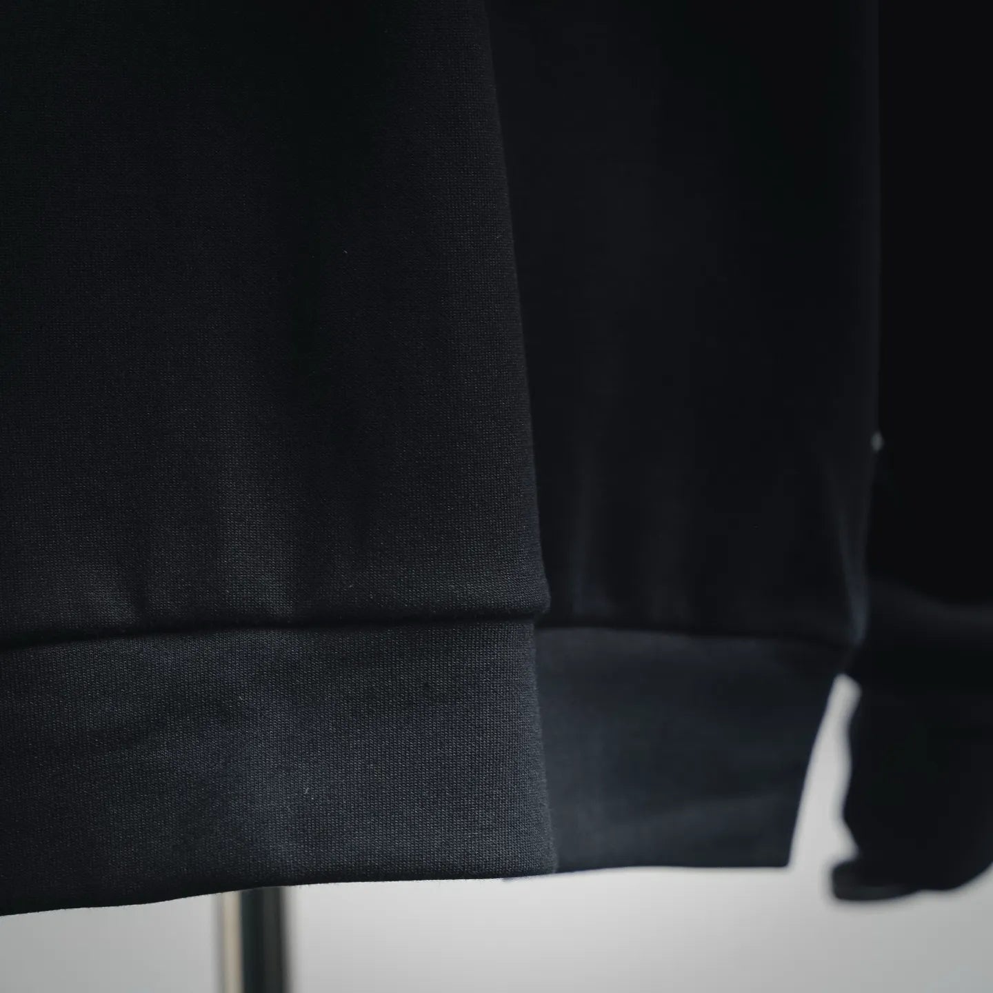 Prada dark jacket hem with elastic cuff detail