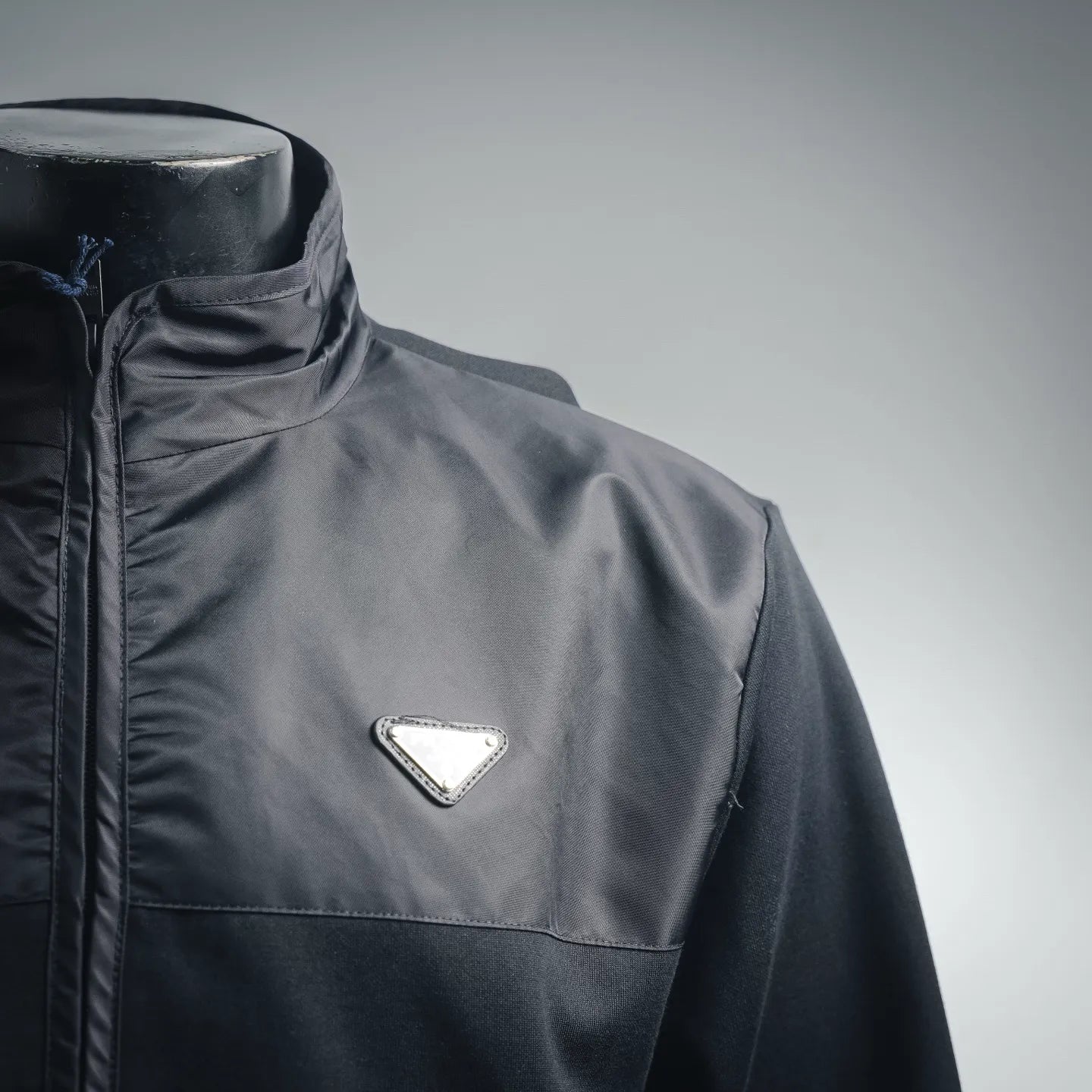 Prada dark jacket with center zipper and triangular logo patch