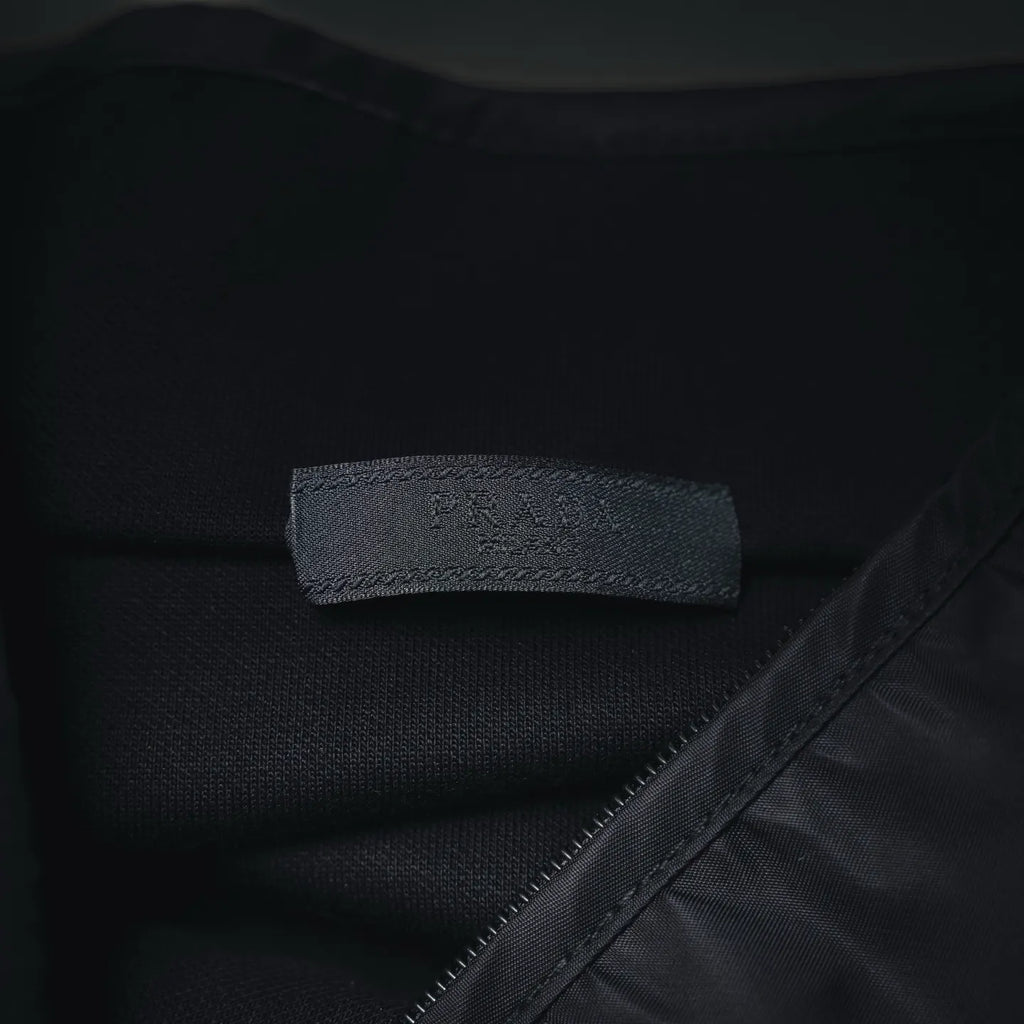 Prada dark jacket interior neck label and seam detail
