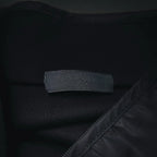 Prada dark jacket interior neck label and seam detail