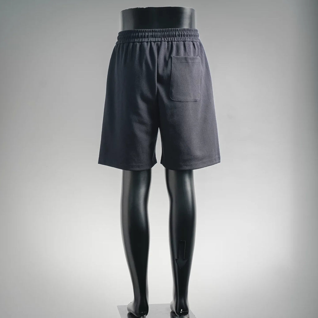 Dark drawstring shorts, rear view with elastic waist and patch pocket detail