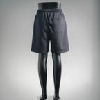 Dark drawstring shorts, rear view with elastic waist and patch pocket detail