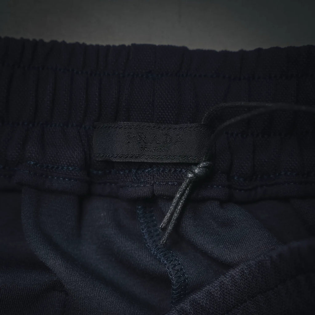 Dark shorts waistband and drawstring at front with elastic seam detail