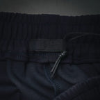 Dark shorts waistband and drawstring at front with elastic seam detail