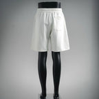 White drawstring shorts with elastic waistband, front view from behind