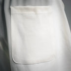 White shorts with front side pocket and topstitched pocket opening