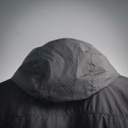 Black hood with draped collar detail on a hooded jacket
