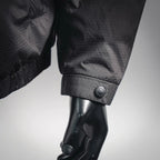 Black jacket sleeve cuff with snap button on mannequin