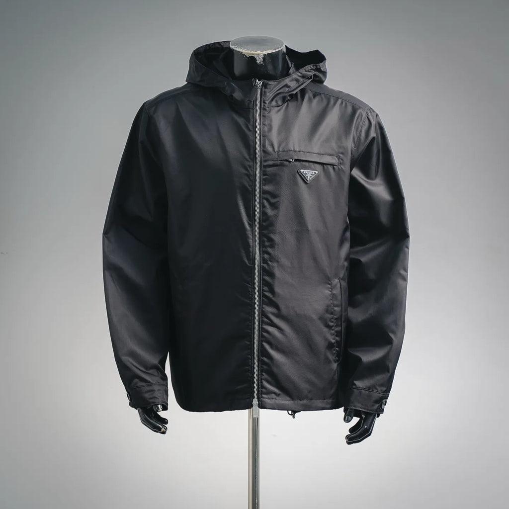 Black hooded zip jacket with PRADA triangle logo patch on the chest