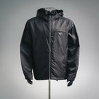Black hooded zip jacket with PRADA triangle logo patch on the chest
