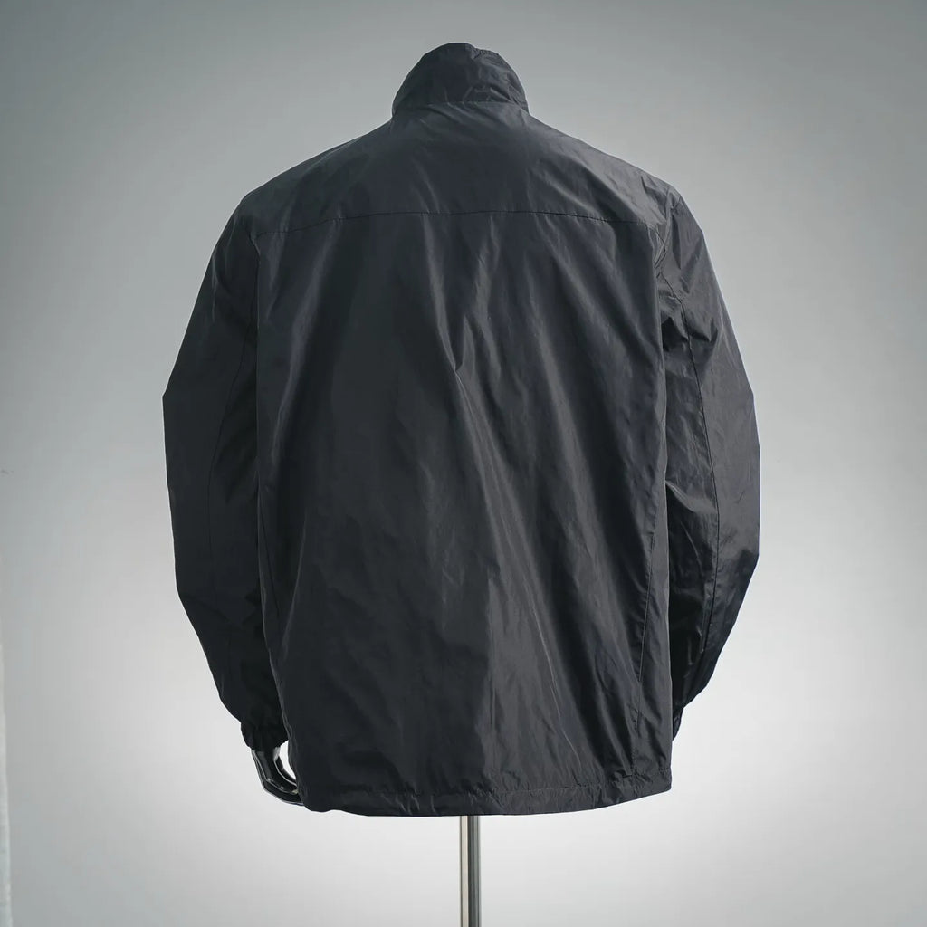 Black zip-up nylon jacket back view with stand collar