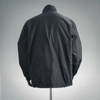 Black zip-up nylon jacket back view with stand collar