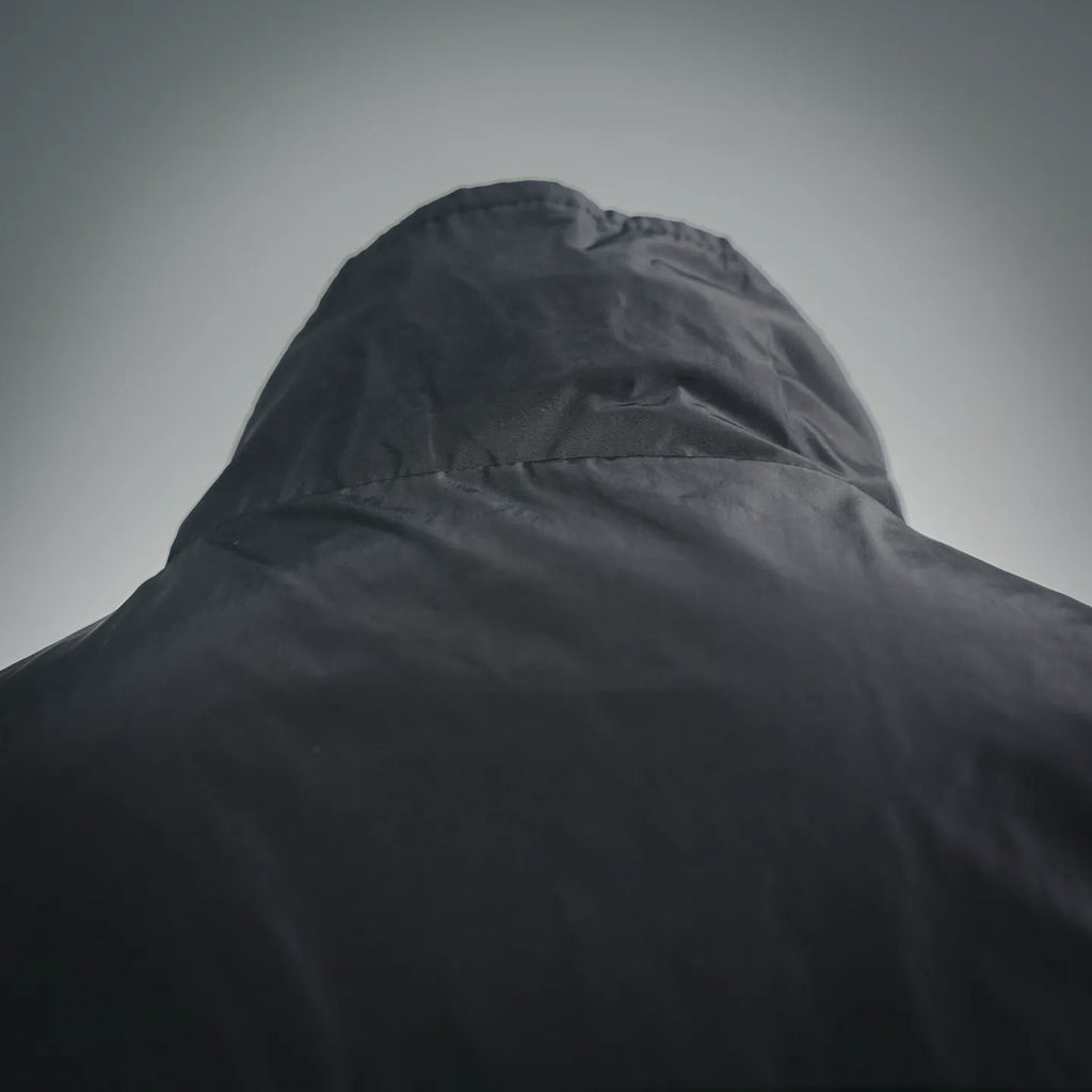 Black nylon hood with structured crown and raised collar