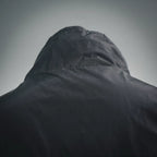 Black nylon hood with structured crown and raised collar