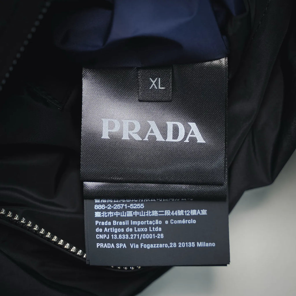 Black inside label showing XL and Prada text with care details