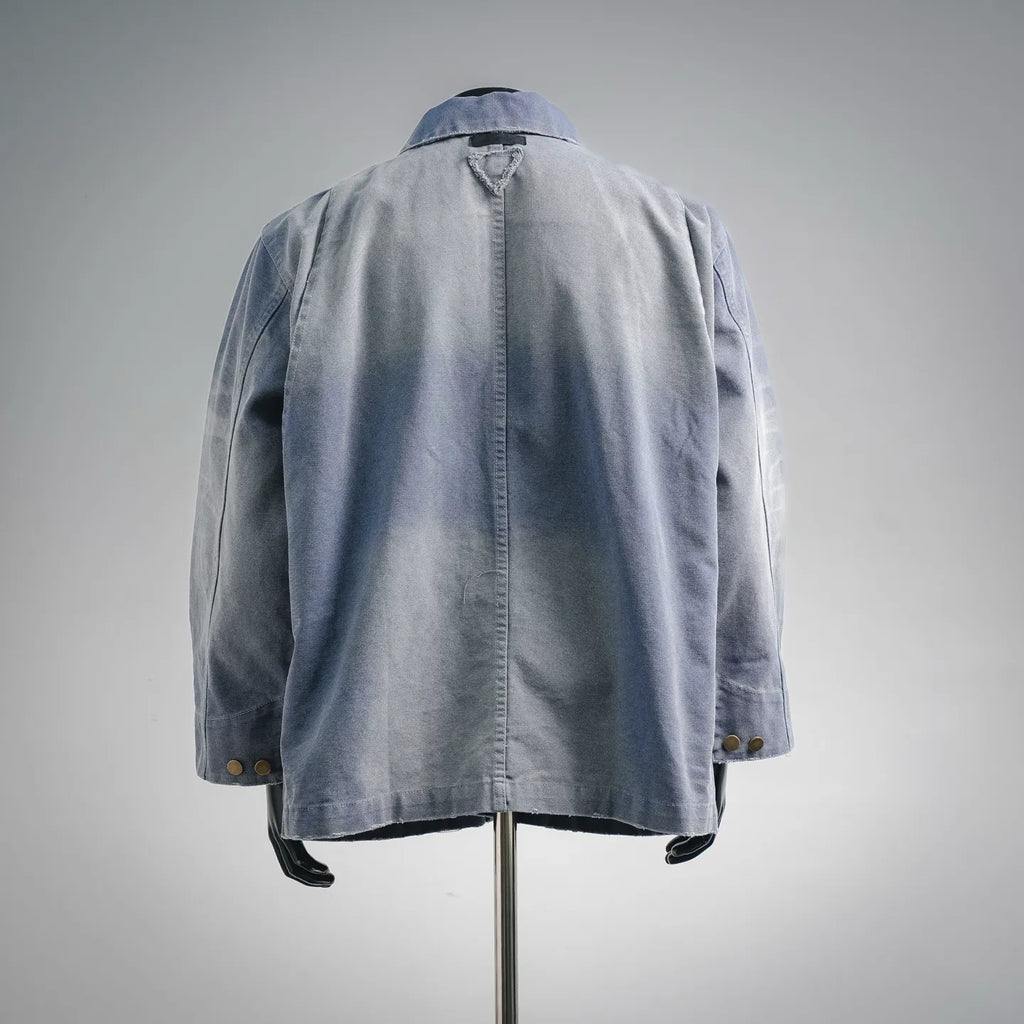 Light blue denim utility jacket, back view with yoke and patch pockets