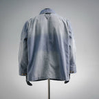 Light blue denim utility jacket, back view with yoke and patch pockets