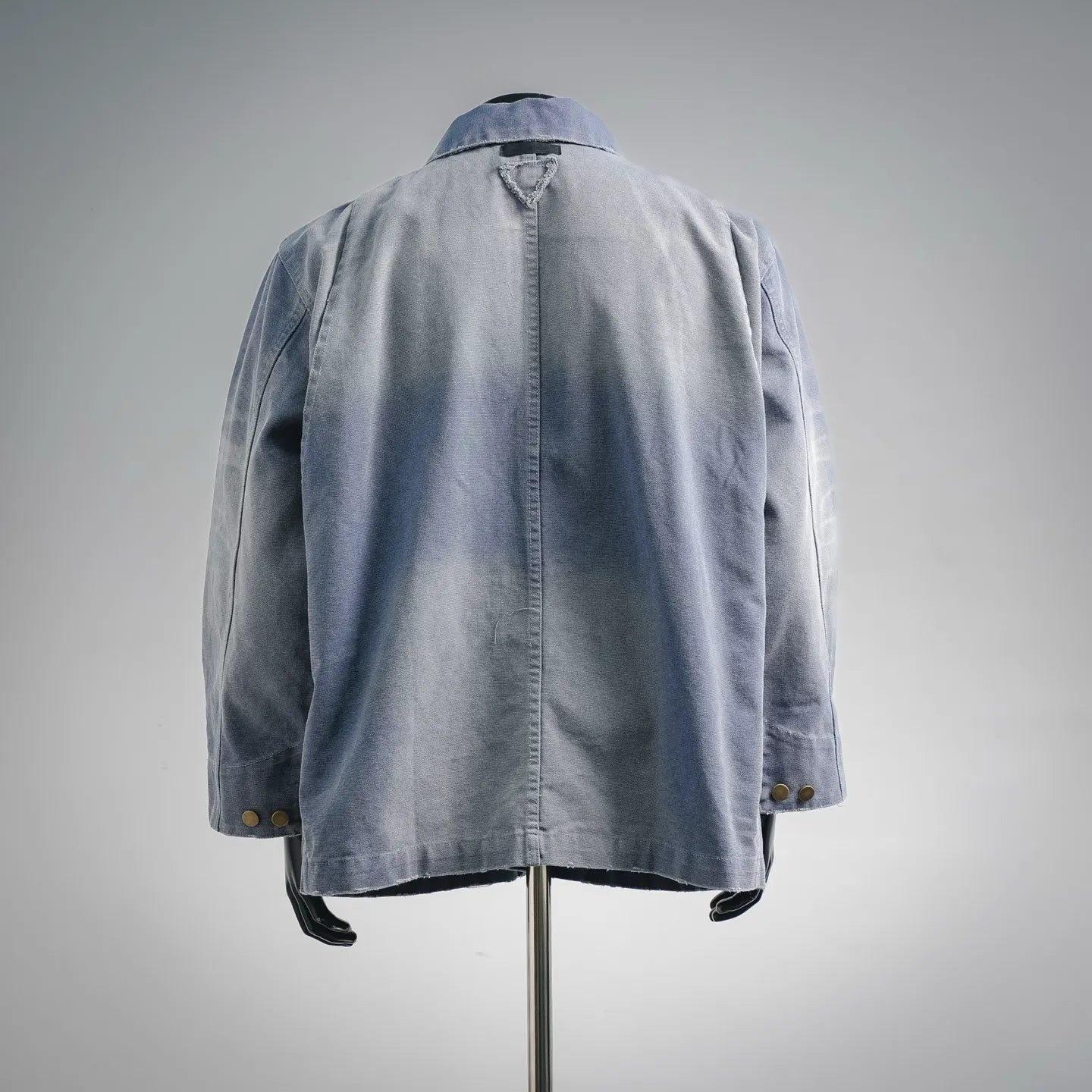 Light blue denim utility jacket, back view with yoke and patch pockets