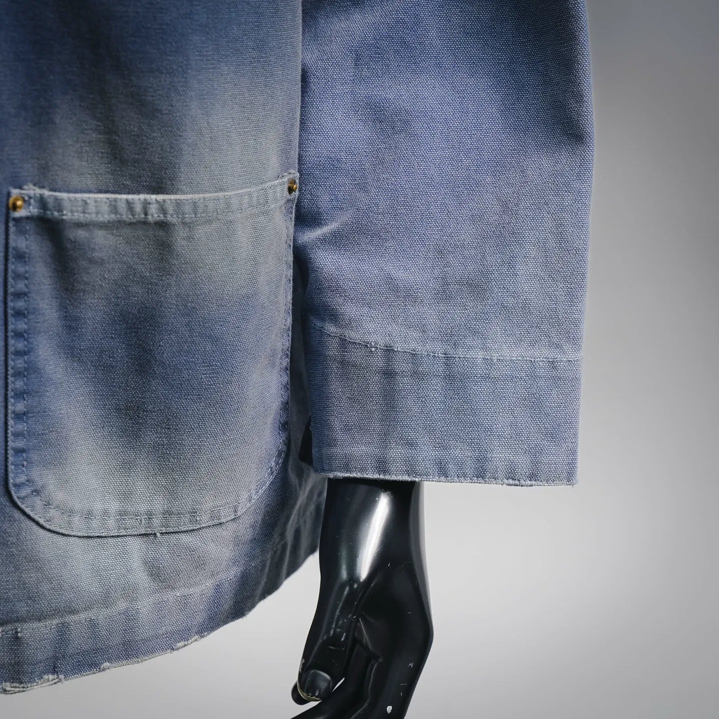 Light blue denim jacket sleeve with patch pocket detail