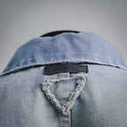 Light blue denim jacket back yoke with triangular inner label