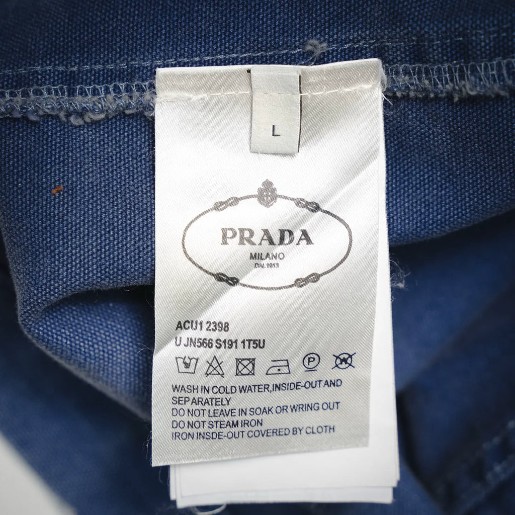 Prada label on light blue denim jacket size L