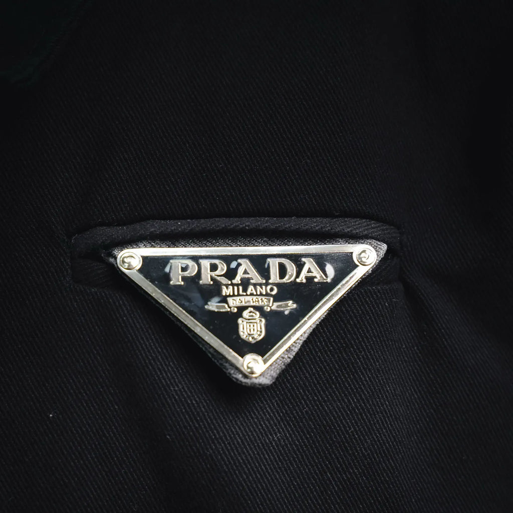 Black jacket with PRADA Milano metal logo tag on chest