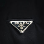 Black jacket with PRADA Milano metal logo tag on chest