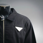 Black jacket collar with zipper and triangular chest patch pocket