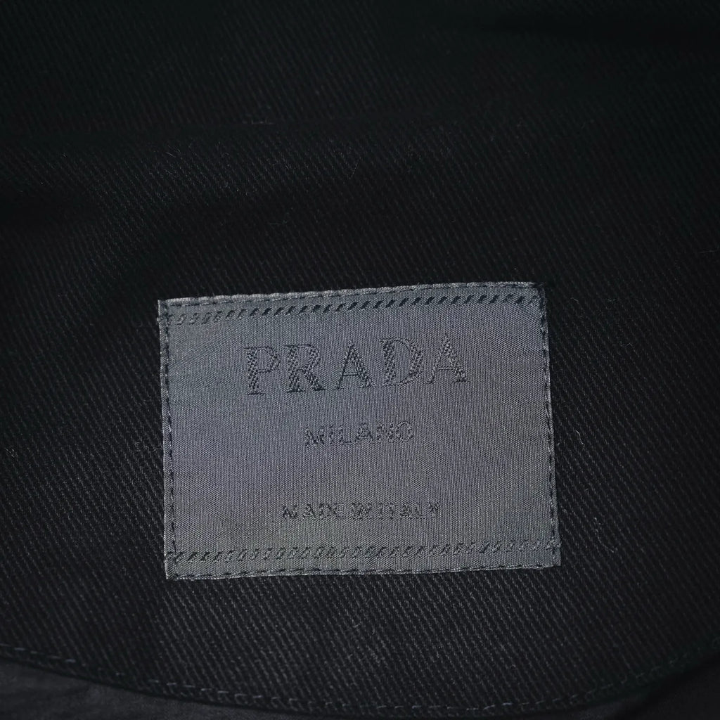 PRADA Milano size label inside black jacket, stitched tag