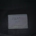 PRADA Milano size label inside black jacket, stitched tag