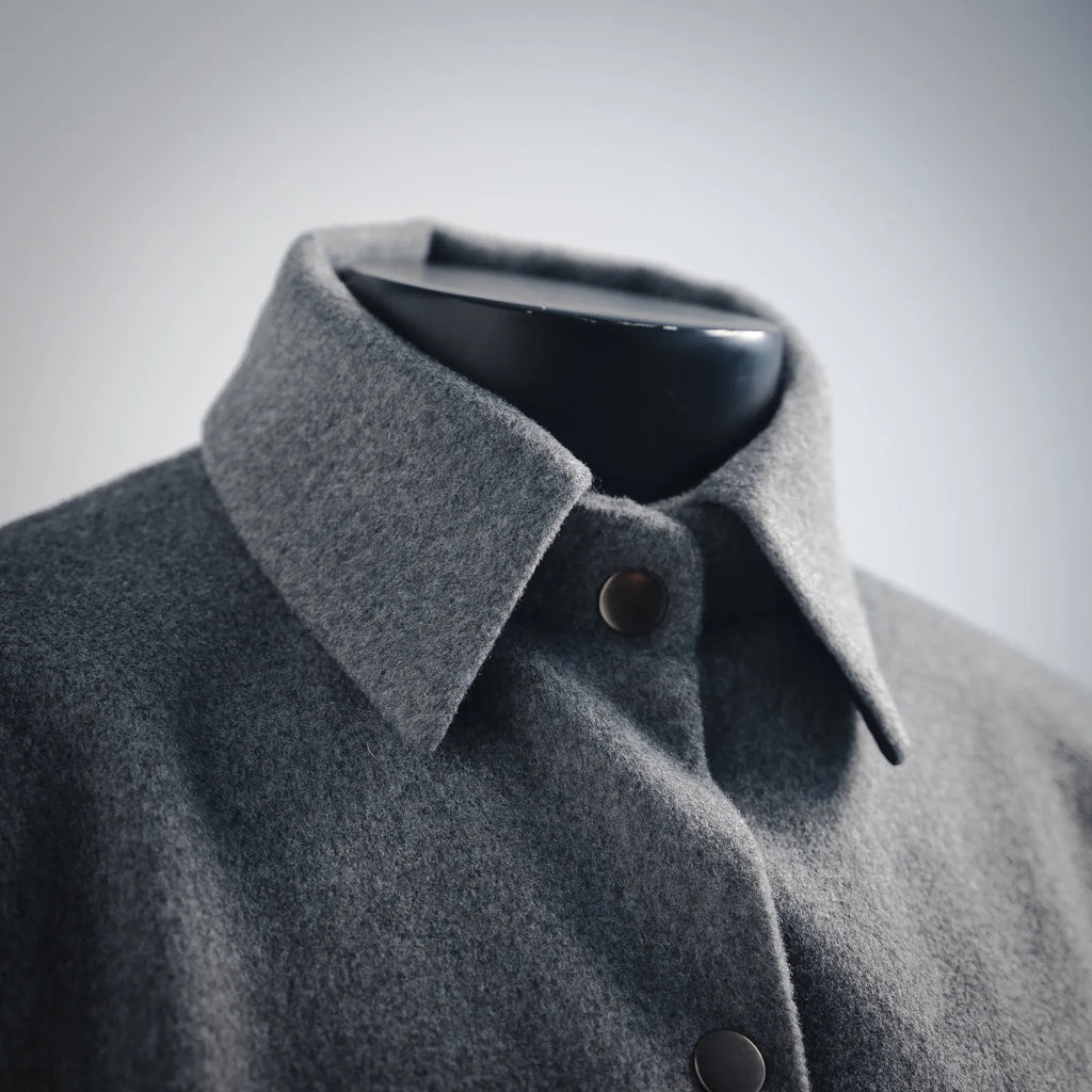 Gray wool jacket with spread collar and dark buttons