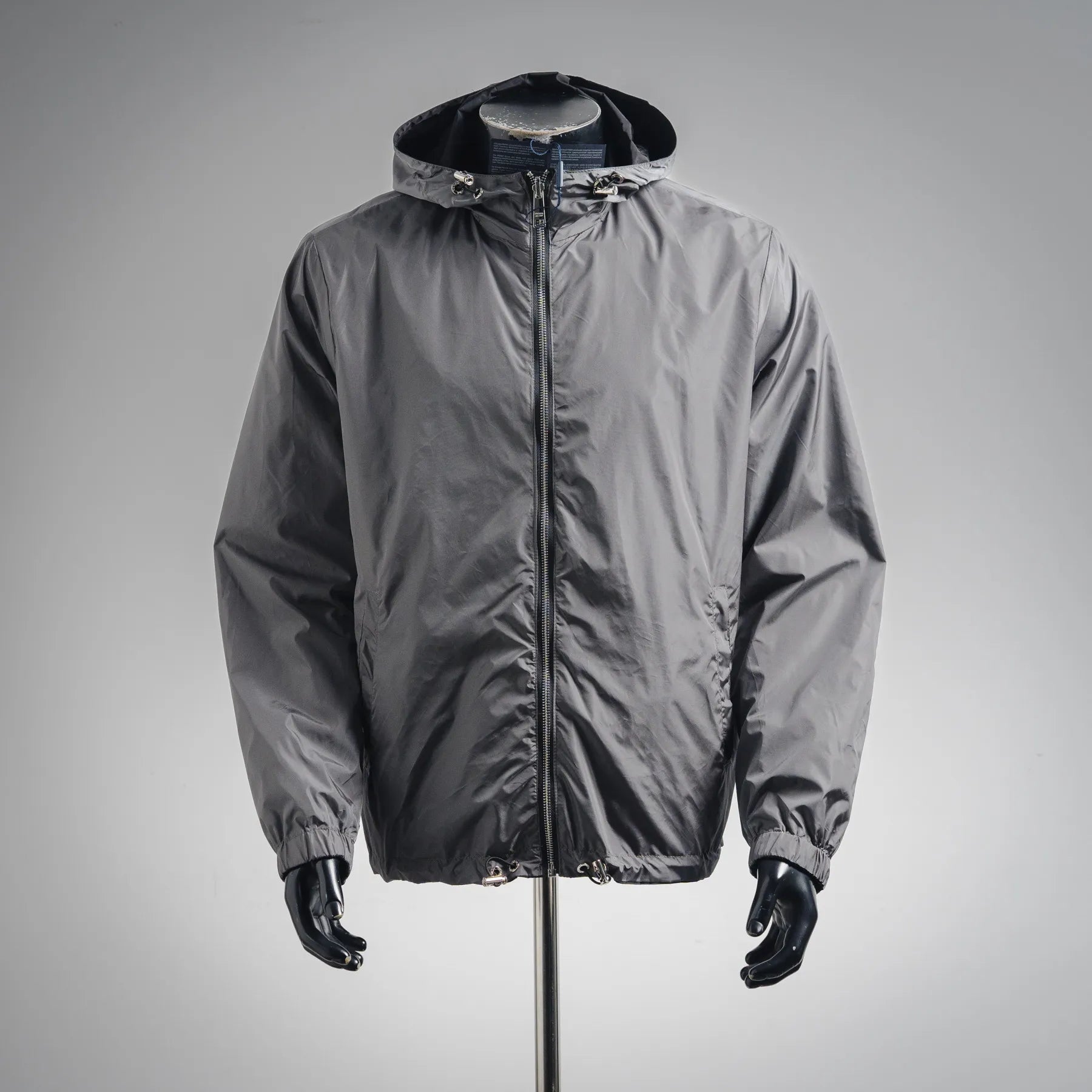 Hooded zip-up jacket in dark gray with elastic cuffs and drawstring hem